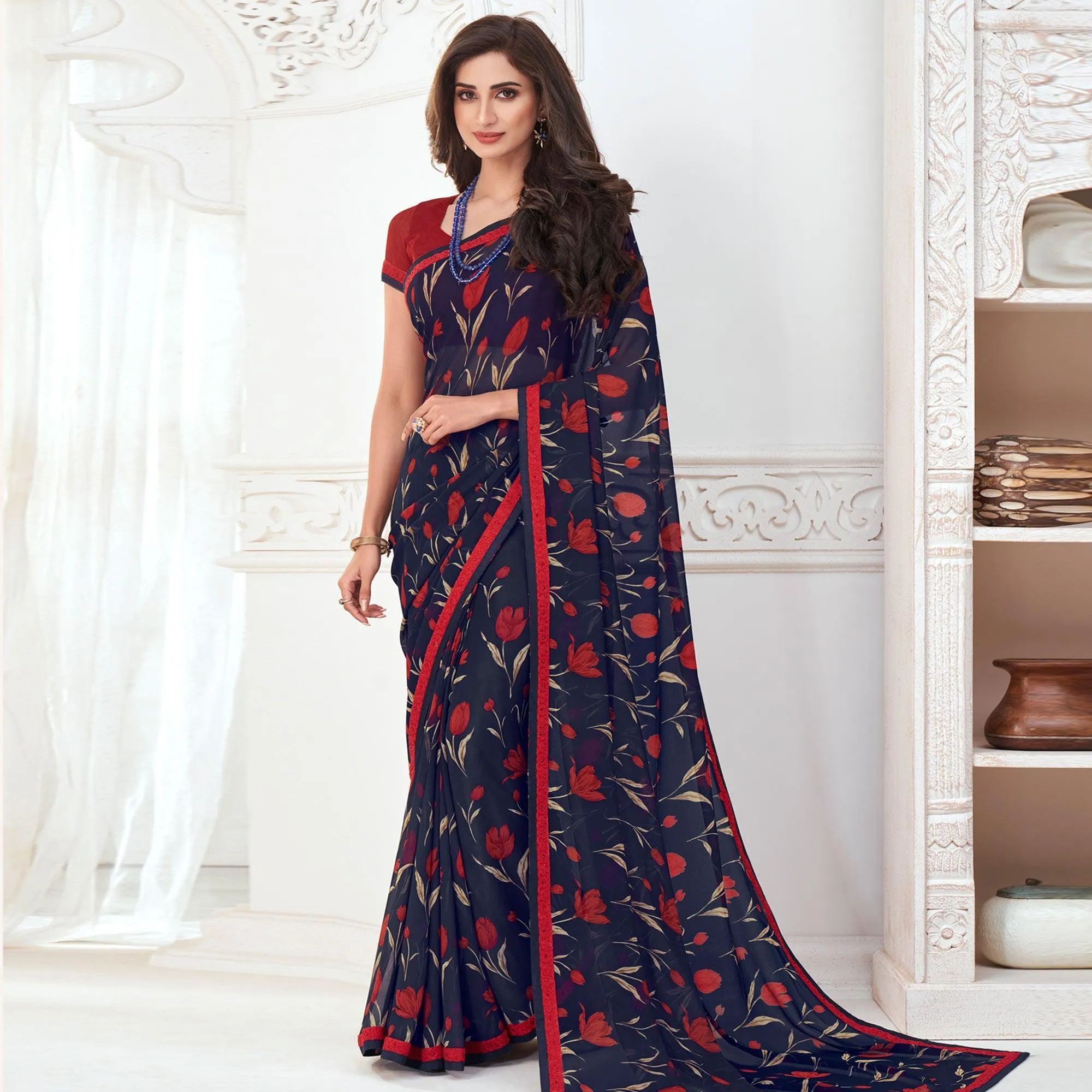 Adorable Navy Blue Colored Casual Wear Floral Printed Pure Georgette Saree